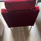 Set of 3 airborne velvet armchairs in red.