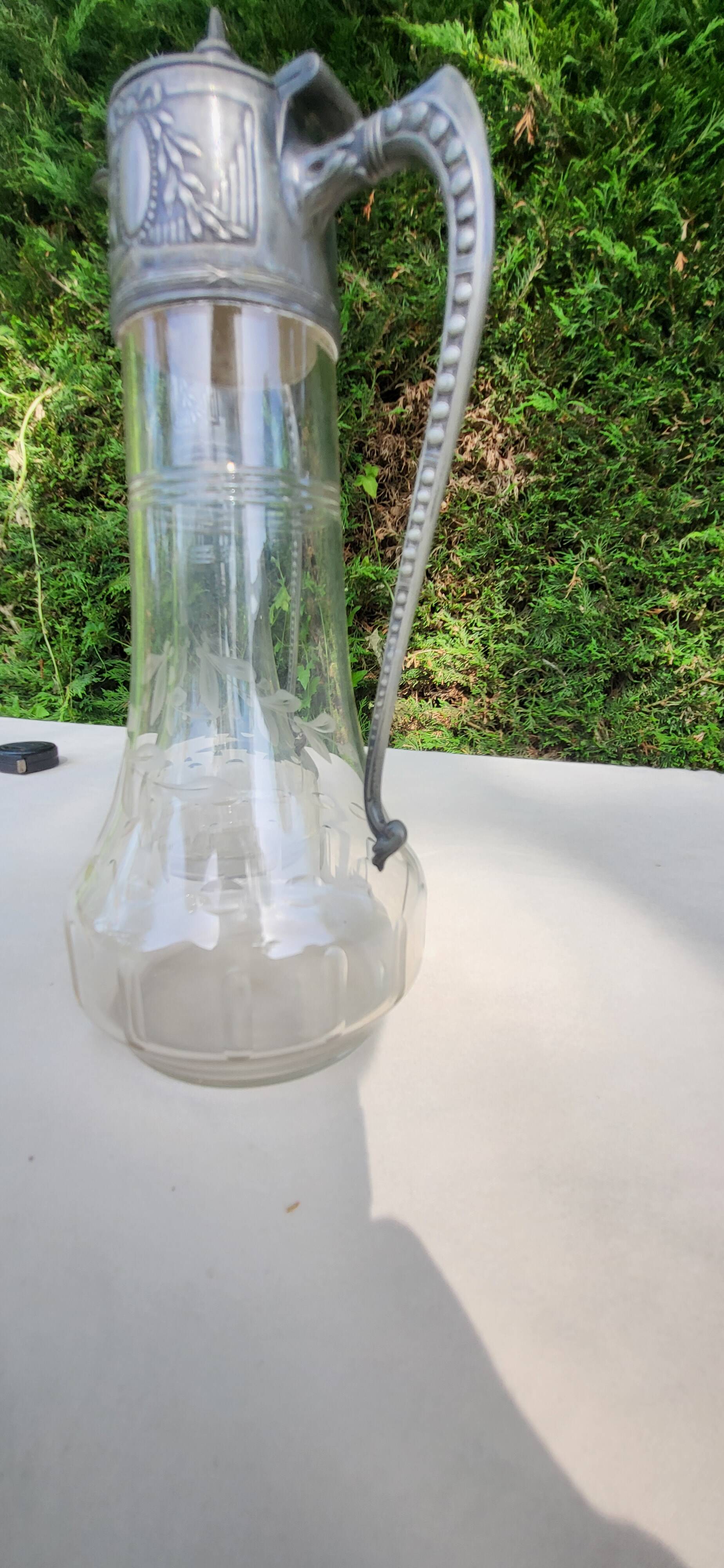 Pair of crystal and pewter jugs