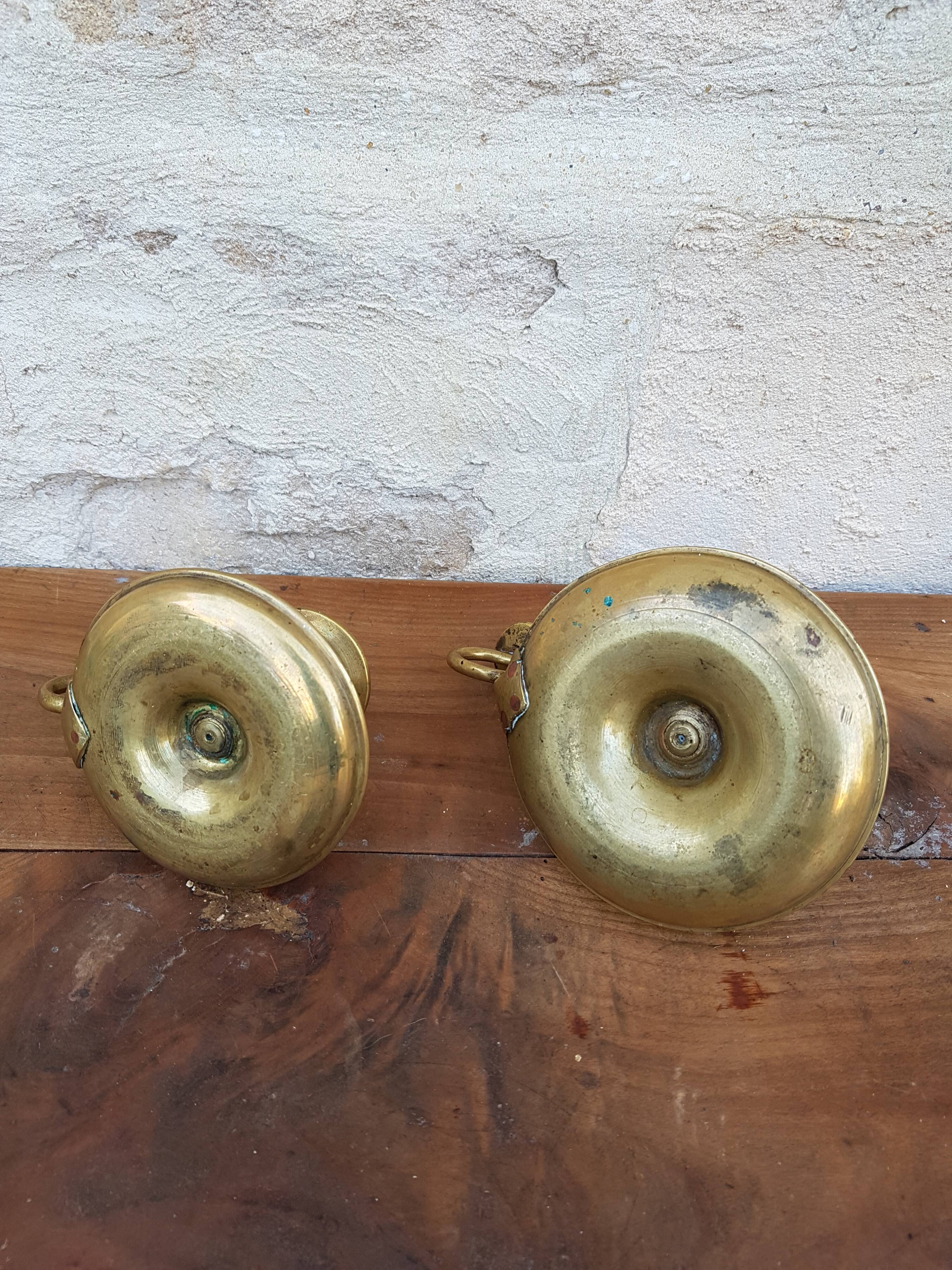 Old pair of brass candlesticks cellar rats