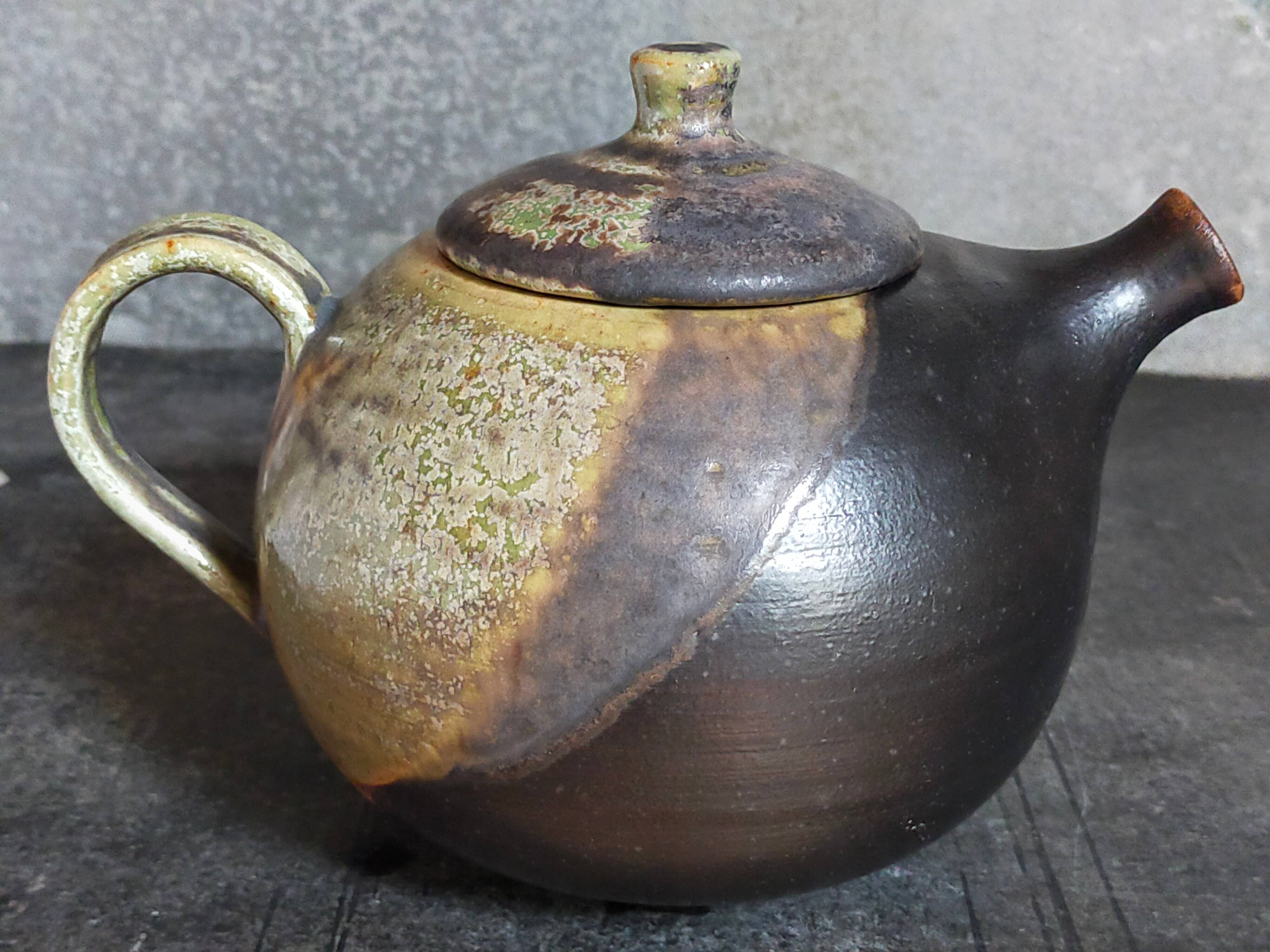 Vintage enameled stoneware potter's teapot
