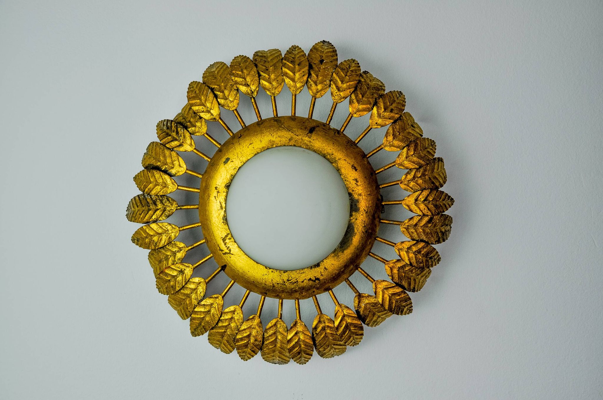 Sun wall lamp by ferro arte, metal and gold leaf and opaline glass, Spain, 1960