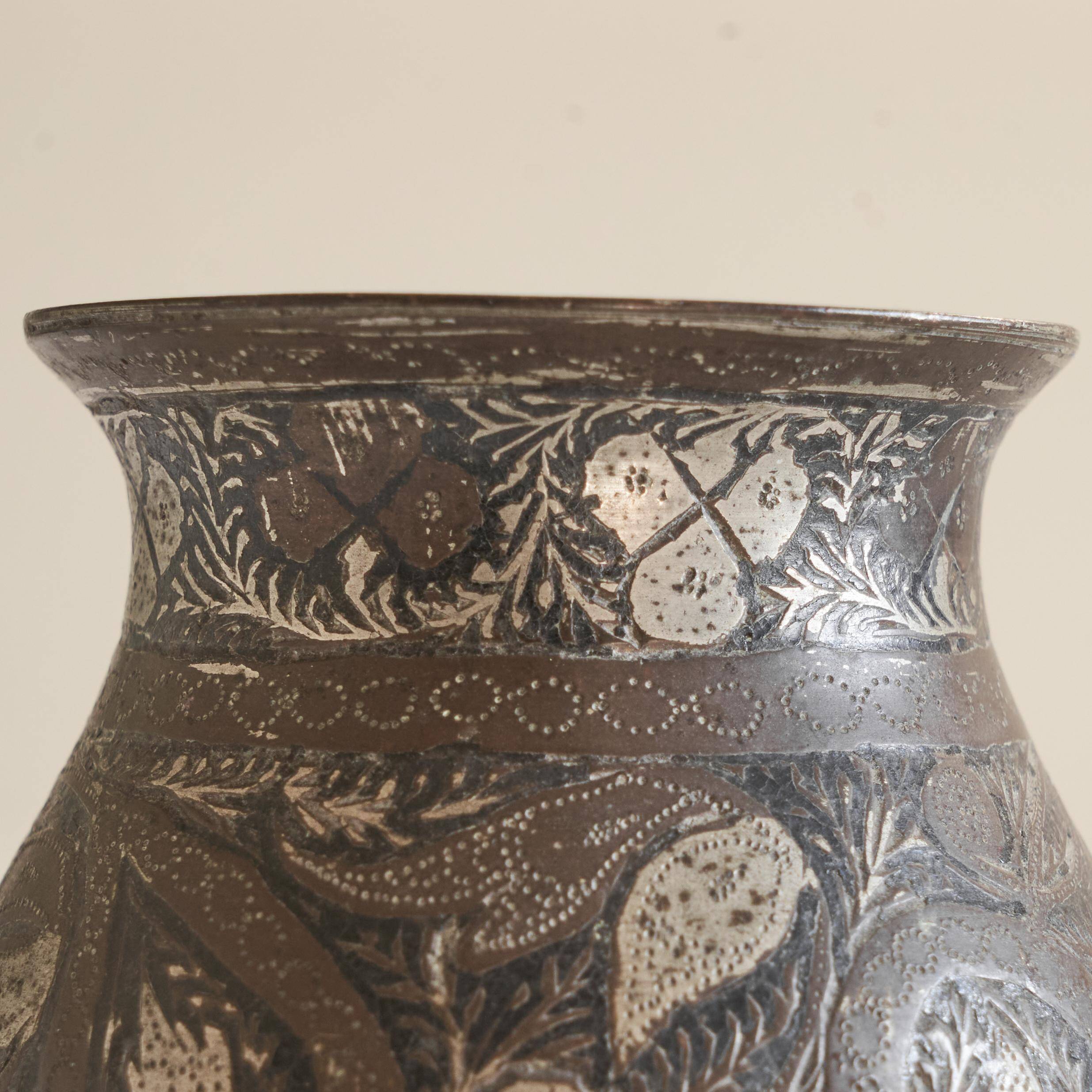 Antique pyriform Bidri vase in the shape of a pyramid.