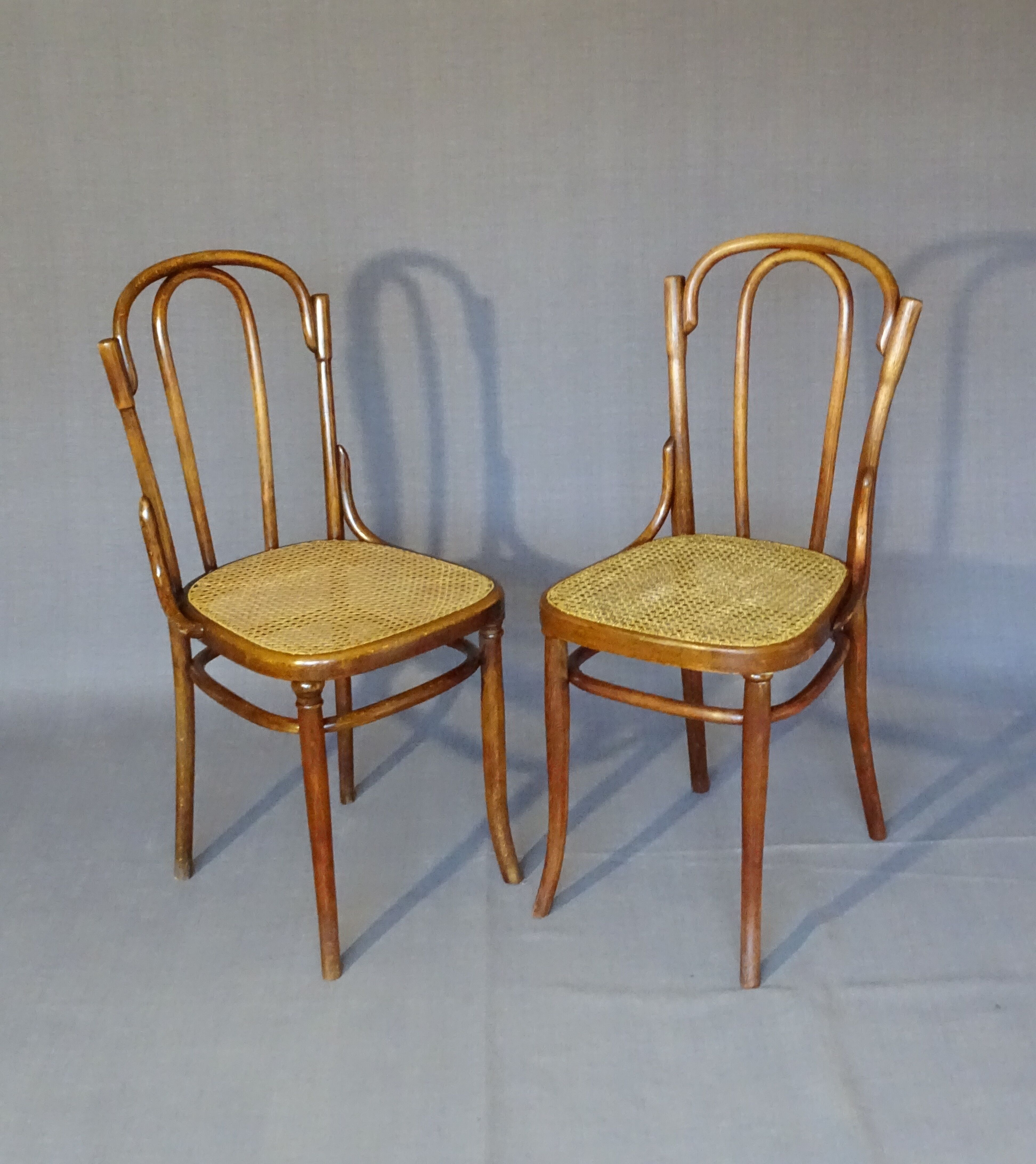 Fake pair of Kohn and Turpe tanned bistro chairs, circa 1900,