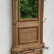 Coat rack with mirror and brass