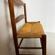 Old wooden and straw bench