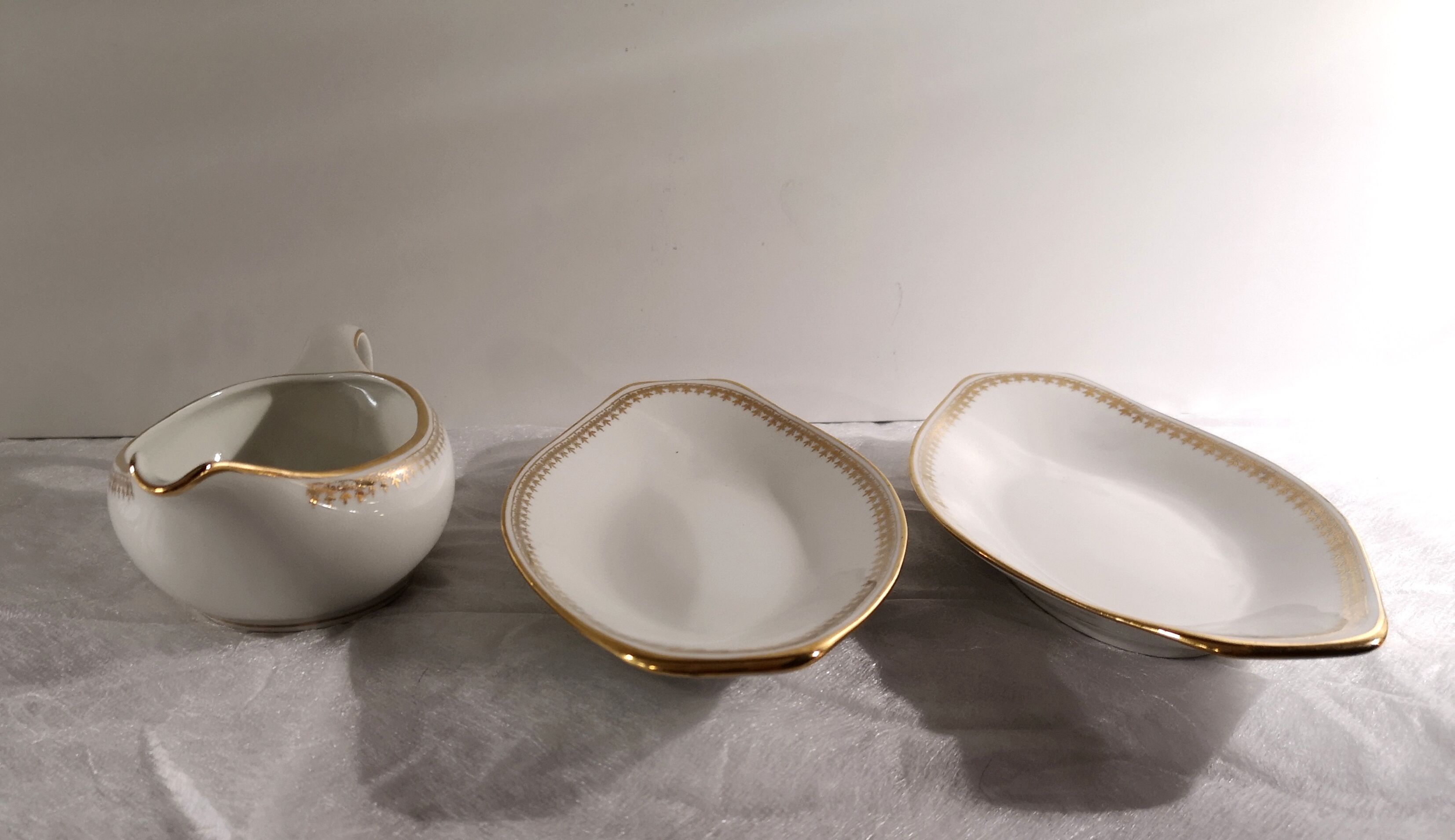 Gravy boat and dishes with gold decoration