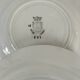 Set of 8 ironstone plates with coordinated designs.