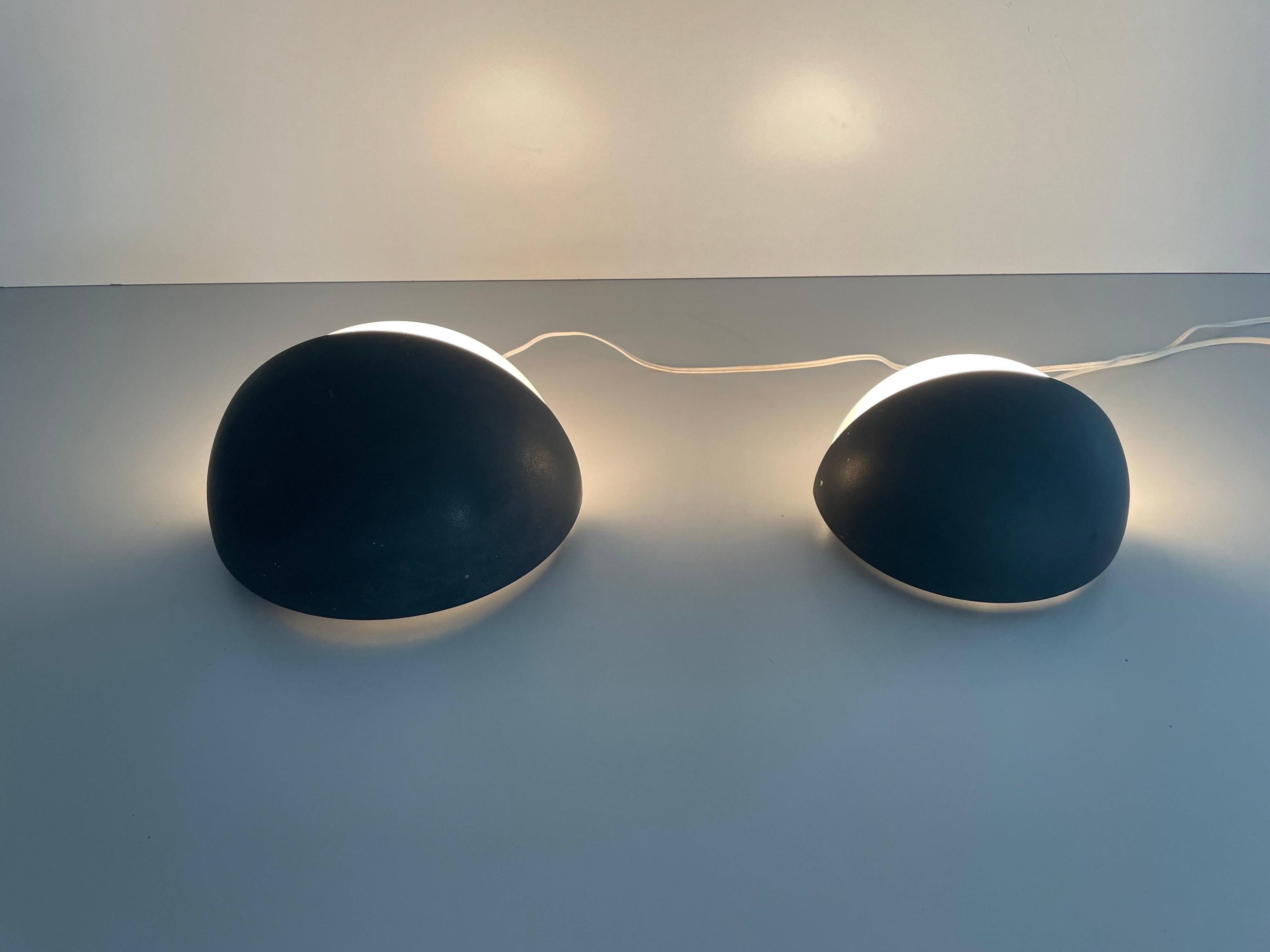 Round black metal wall lights, small and large set, by Bega, 1970s, Germany.