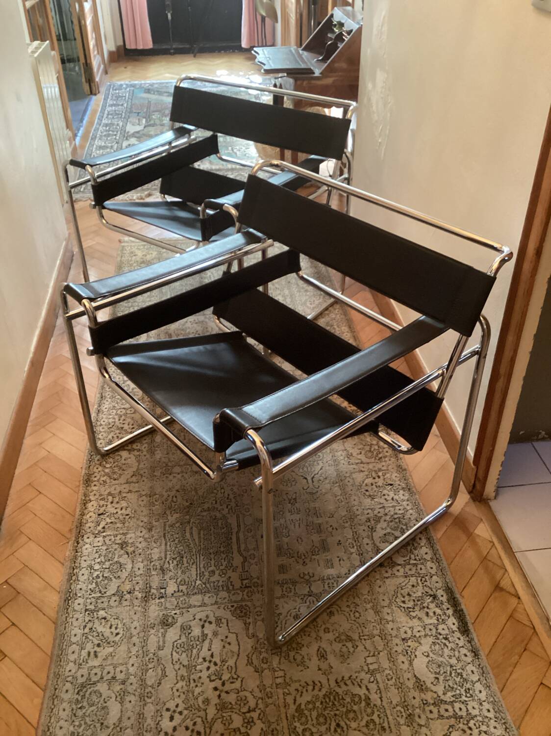 Pair of Wassily black leather armchairs