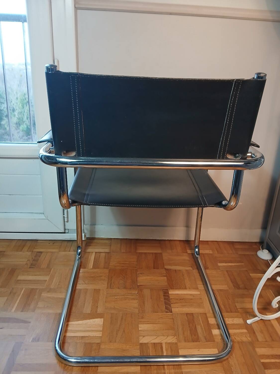 Black leather cantilever chair with chrome steel – Modernist design