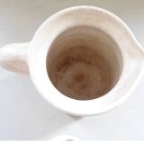 Old earthenware pitcher with its lid
