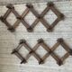 Pair of accordion coat hooks in oak from the 60s-70s.