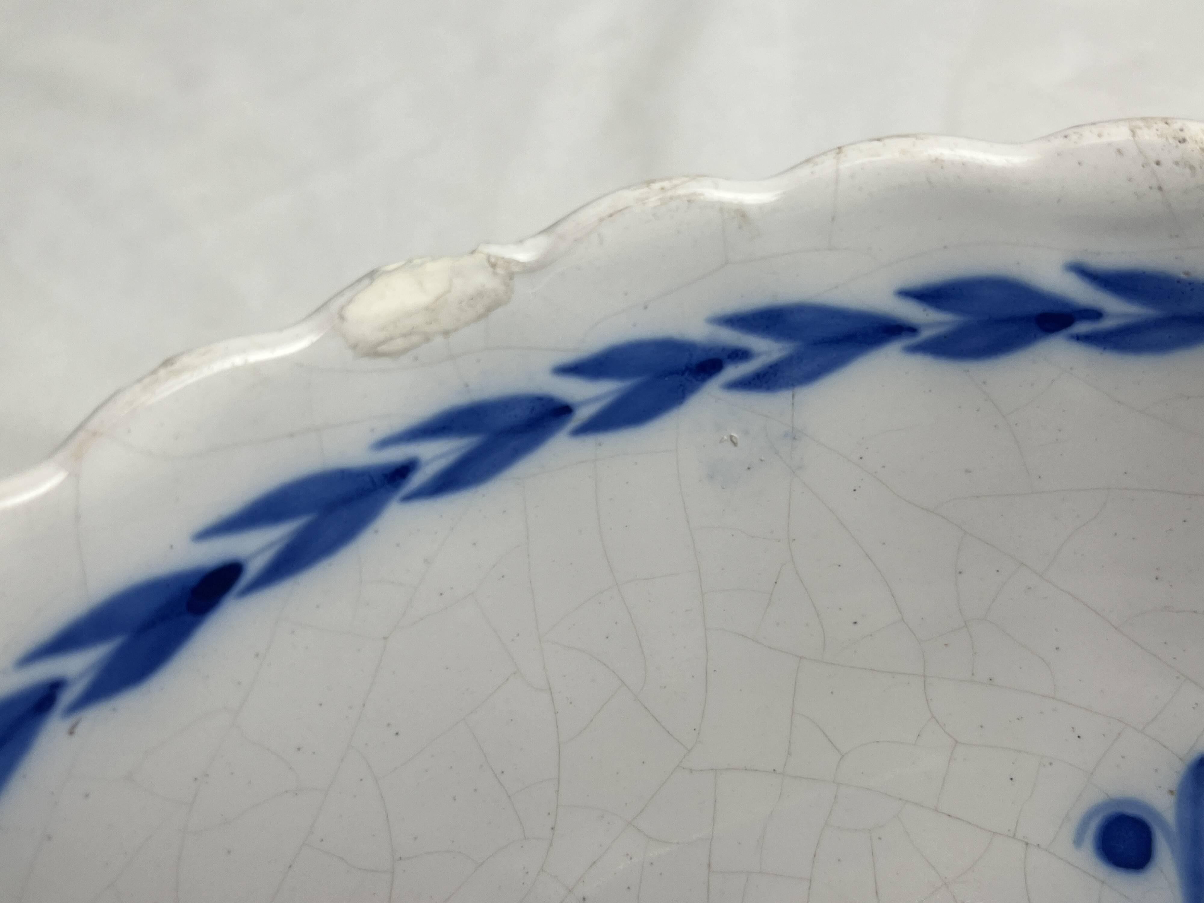 Rambervillers, antique earthenware dish with blue decoration from the 19th century.