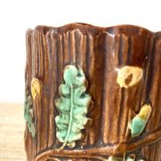 Antique slip pot with acorn decoration