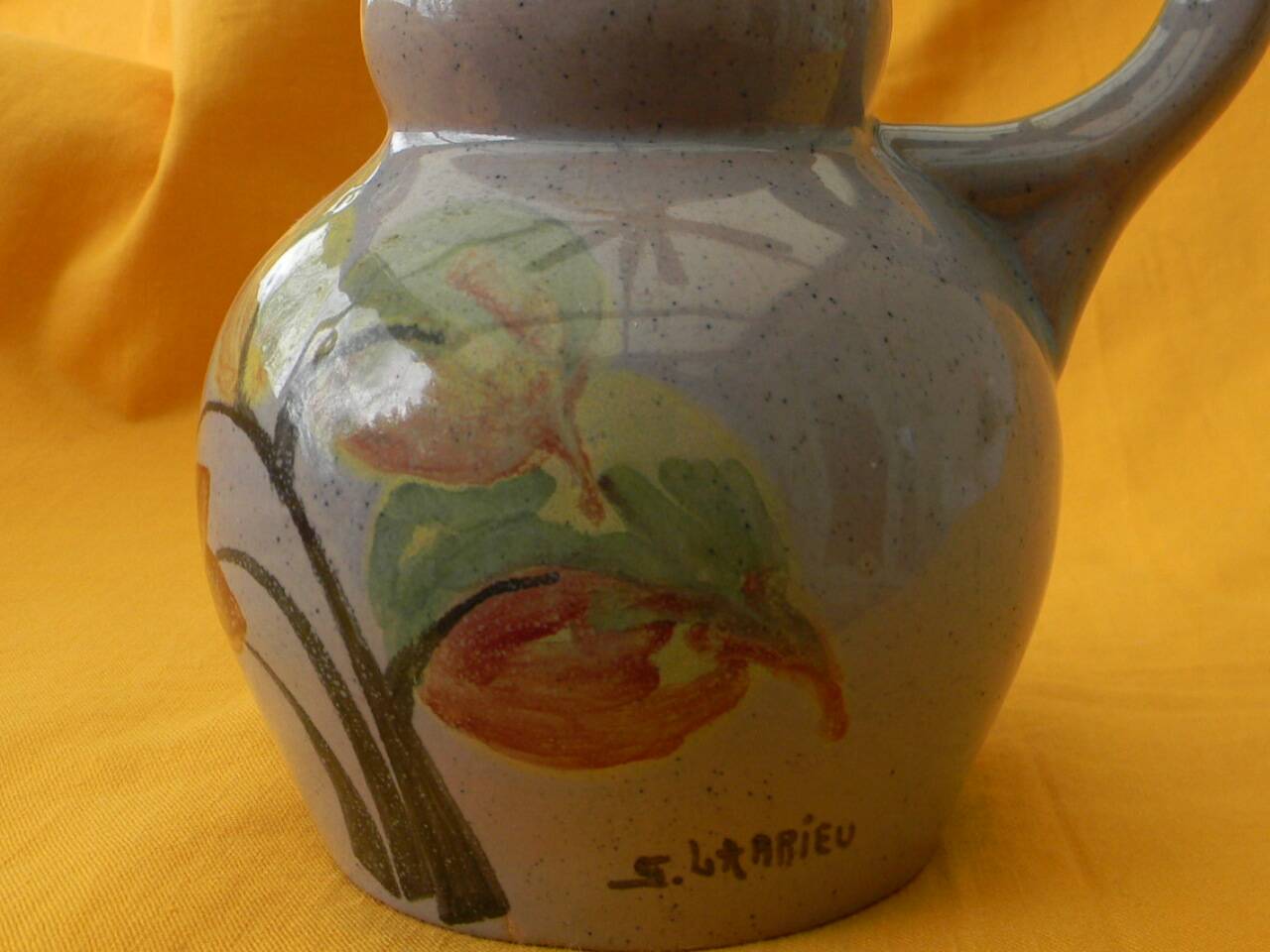 Ceramic pitcher by simone larrieu.