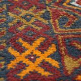 Antique oriental rug featuring orange details 135x81cm