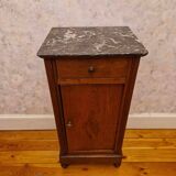 Antique wooden bedside table with black marble top
