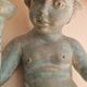 Pairs of wall lights, either two distinct cherubs.