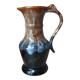 Vintage 1960s brown and blue flame-patterned stoneware wine jug carafe.