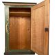 Alsatian bonnet maker in painted softwood with floral decorations