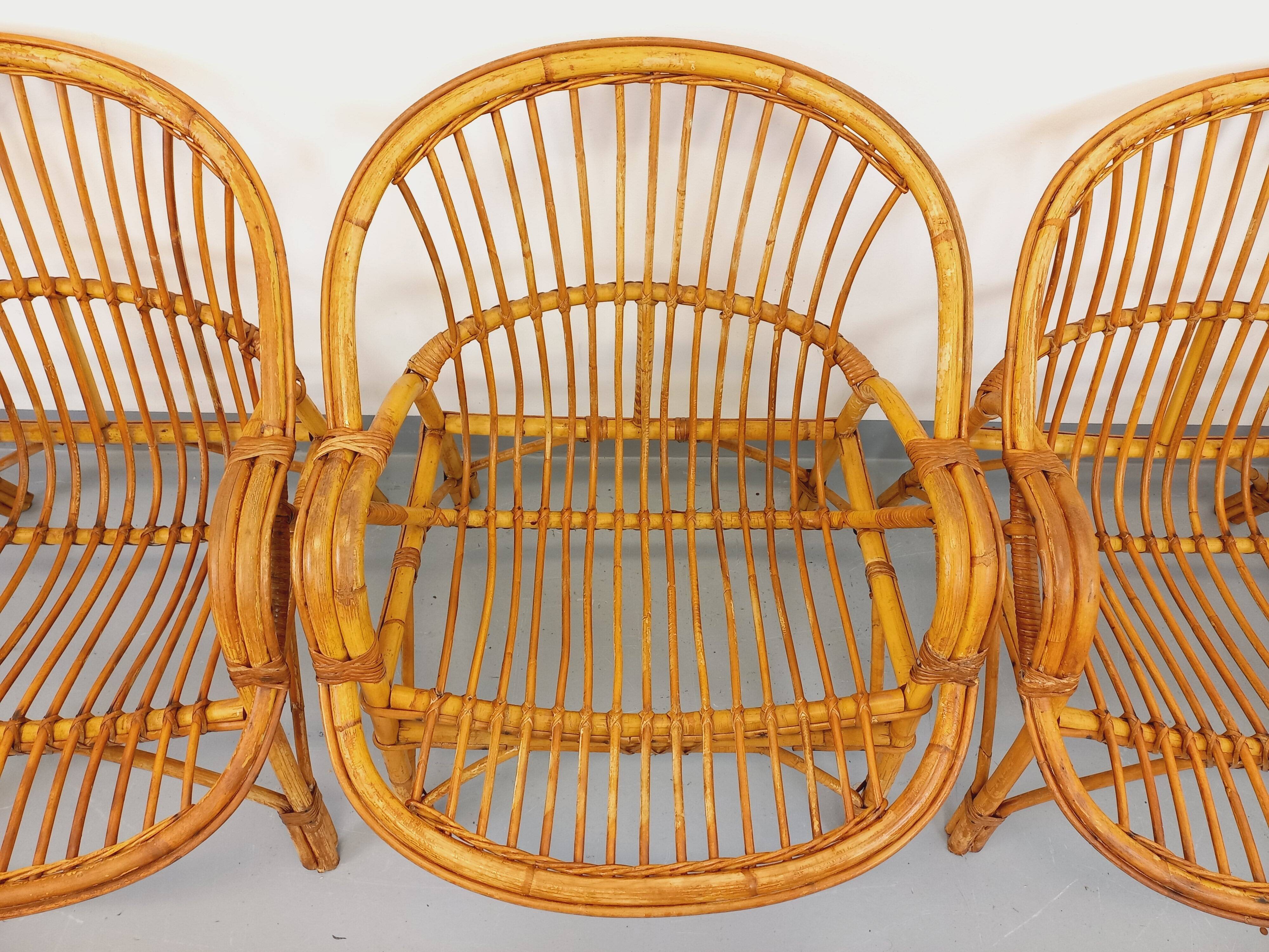 Set of 4 vintage rattan armchairs from the 60s