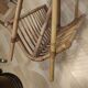 Rattan and frosted glass end table with magazine rack