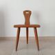Low brutalist tripod chair in solid oak from the 1960s.