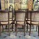 Suite de 6 chaises de style Louis XV en noyer et cannage
