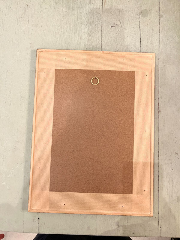 Old board framed under glass, bird