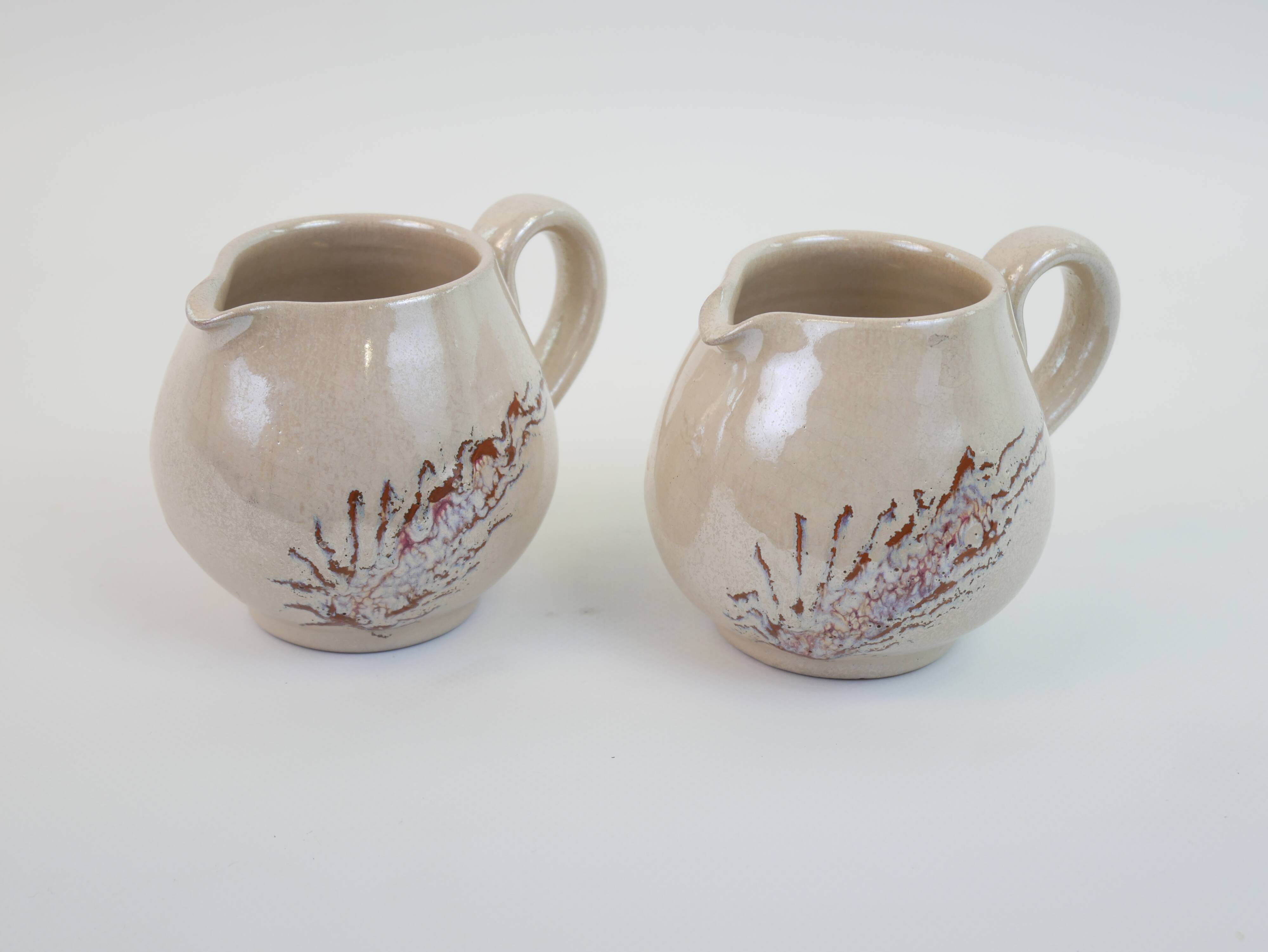 Pair of ceramic milk jugs signed La Roue Vallauris