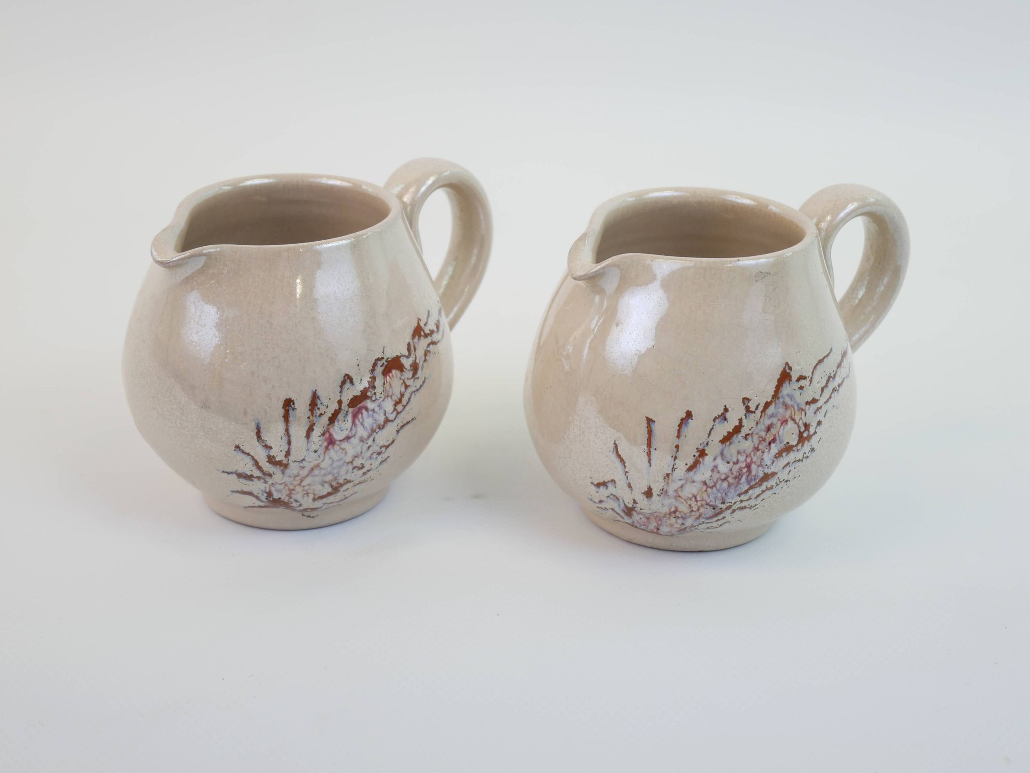 Pair of ceramic milk jugs signed La Roue Vallauris