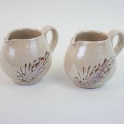Pair of ceramic milk jugs signed La Roue Vallauris