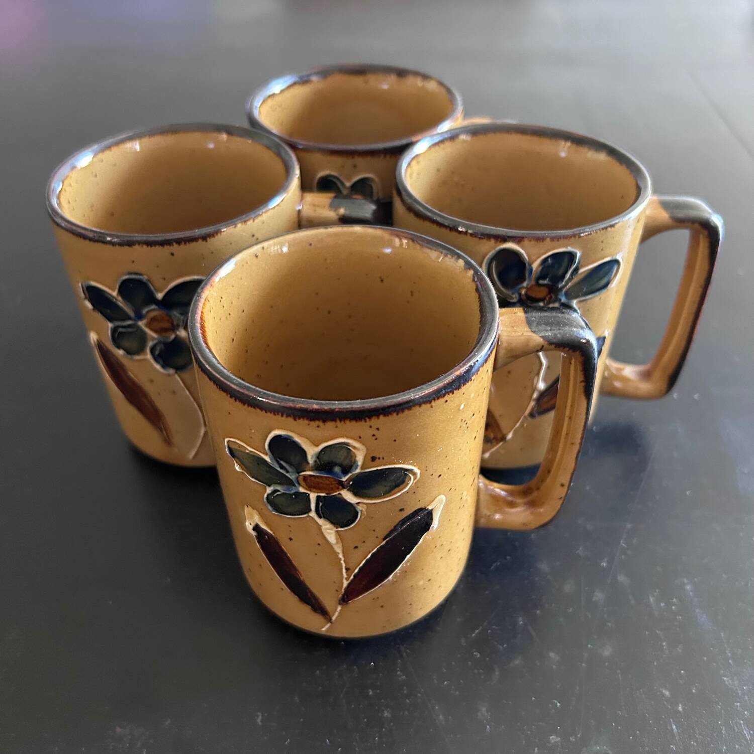 Set of 4 floral decorated mugs