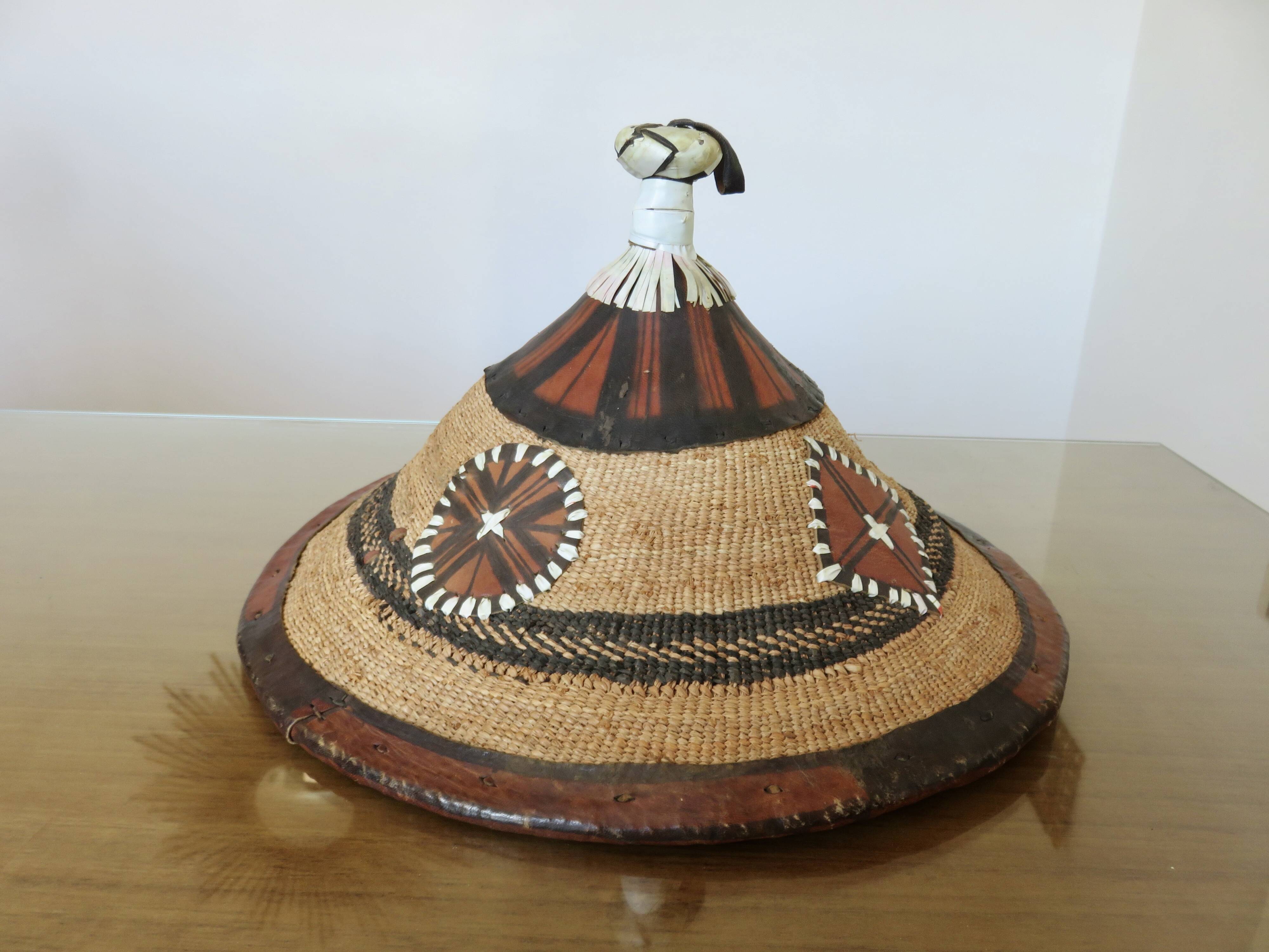 African conical hat, Fulani, in leather and braided rope, 1900, wall decoration