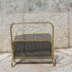 Magazine rack in brass and black lacquered metal, Italy 1970s