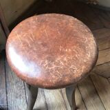 Old leather rotating piano stool