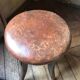 Old leather rotating piano stool