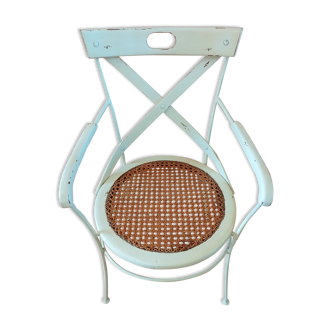 Canned chair with wooden and metal braces