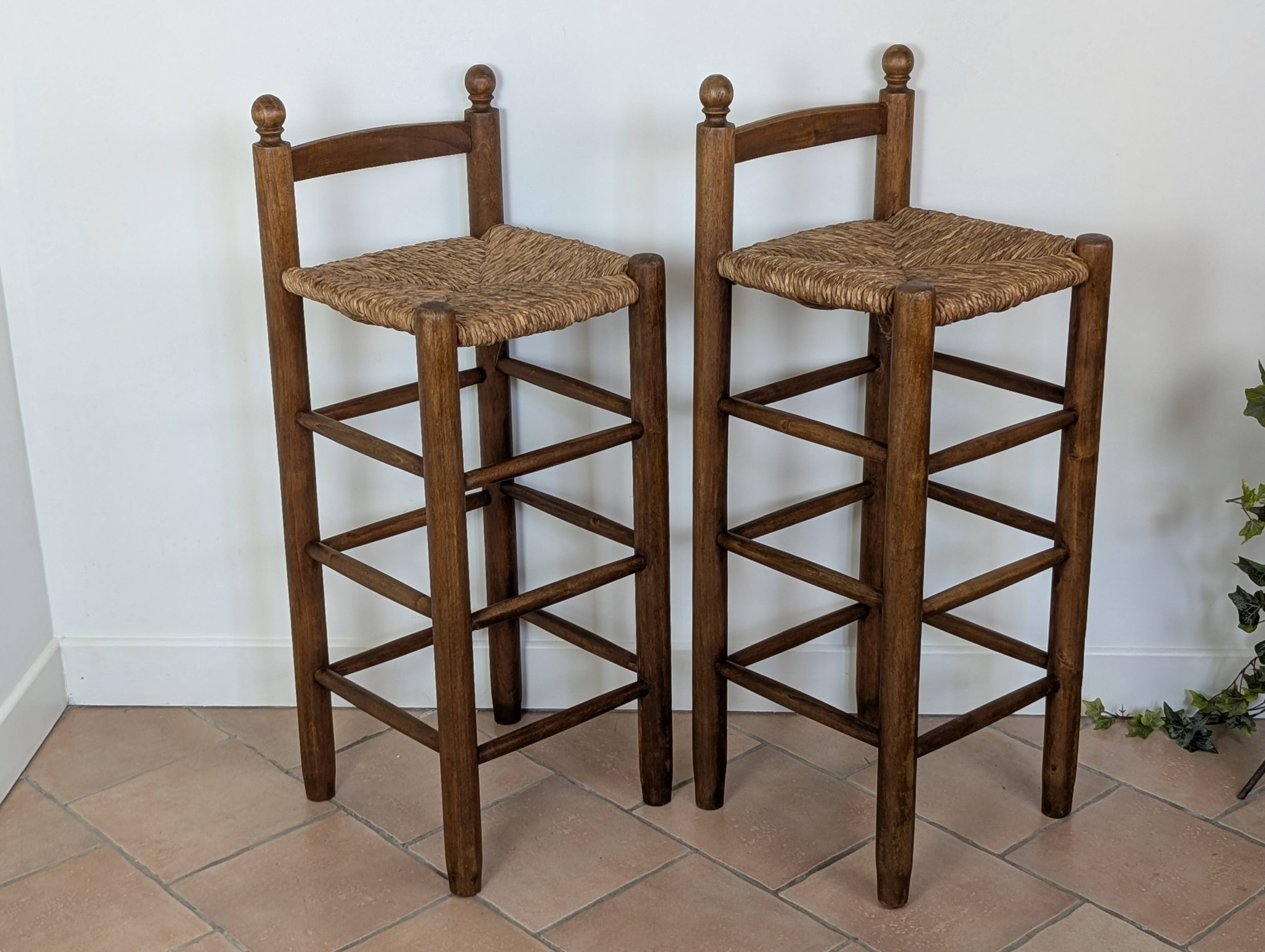 High wooden and straw stools