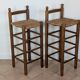 High wooden and straw stools