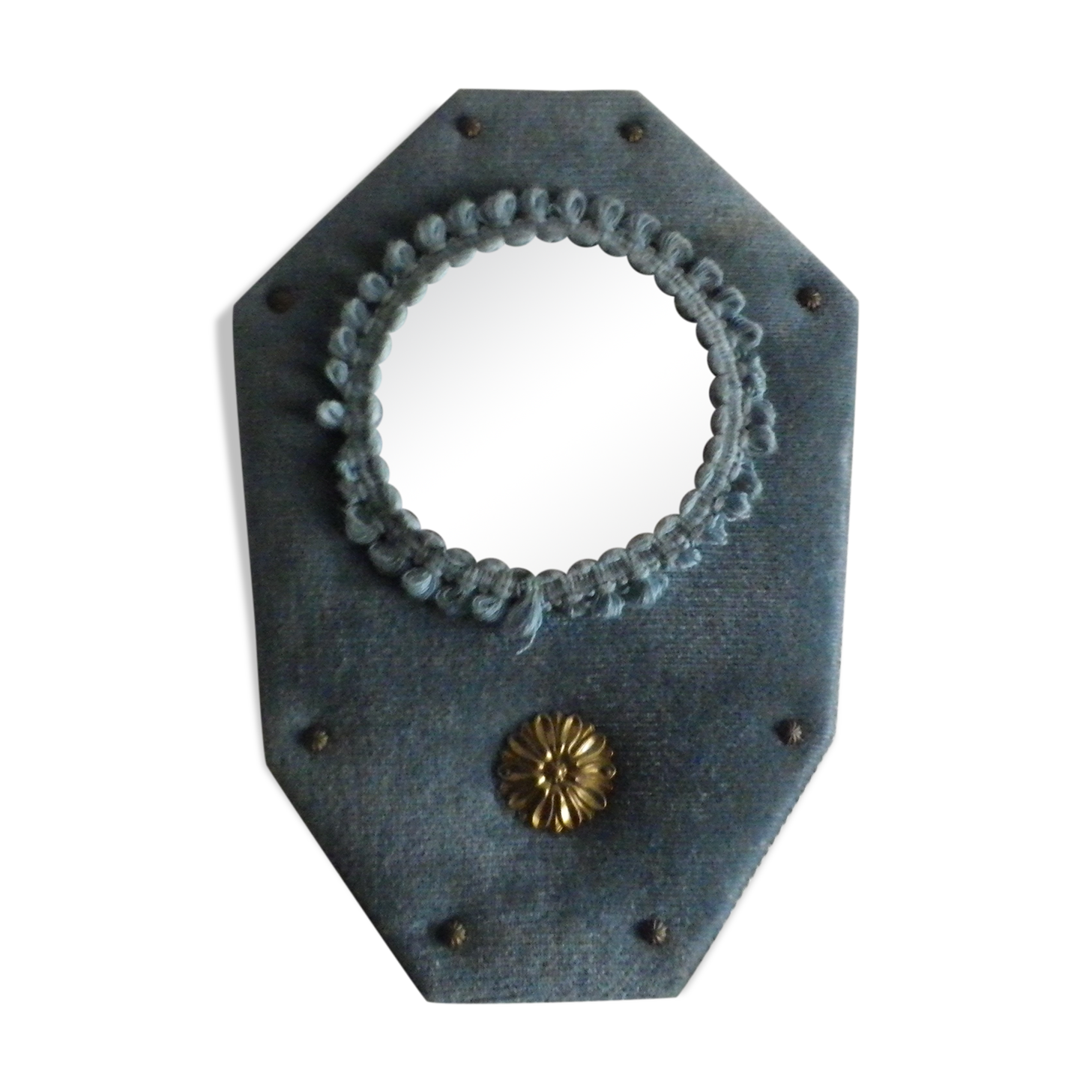 Mirror on blue velvet fabric