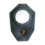 Mirror on blue velvet fabric