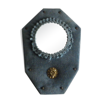 Mirror on blue velvet fabric