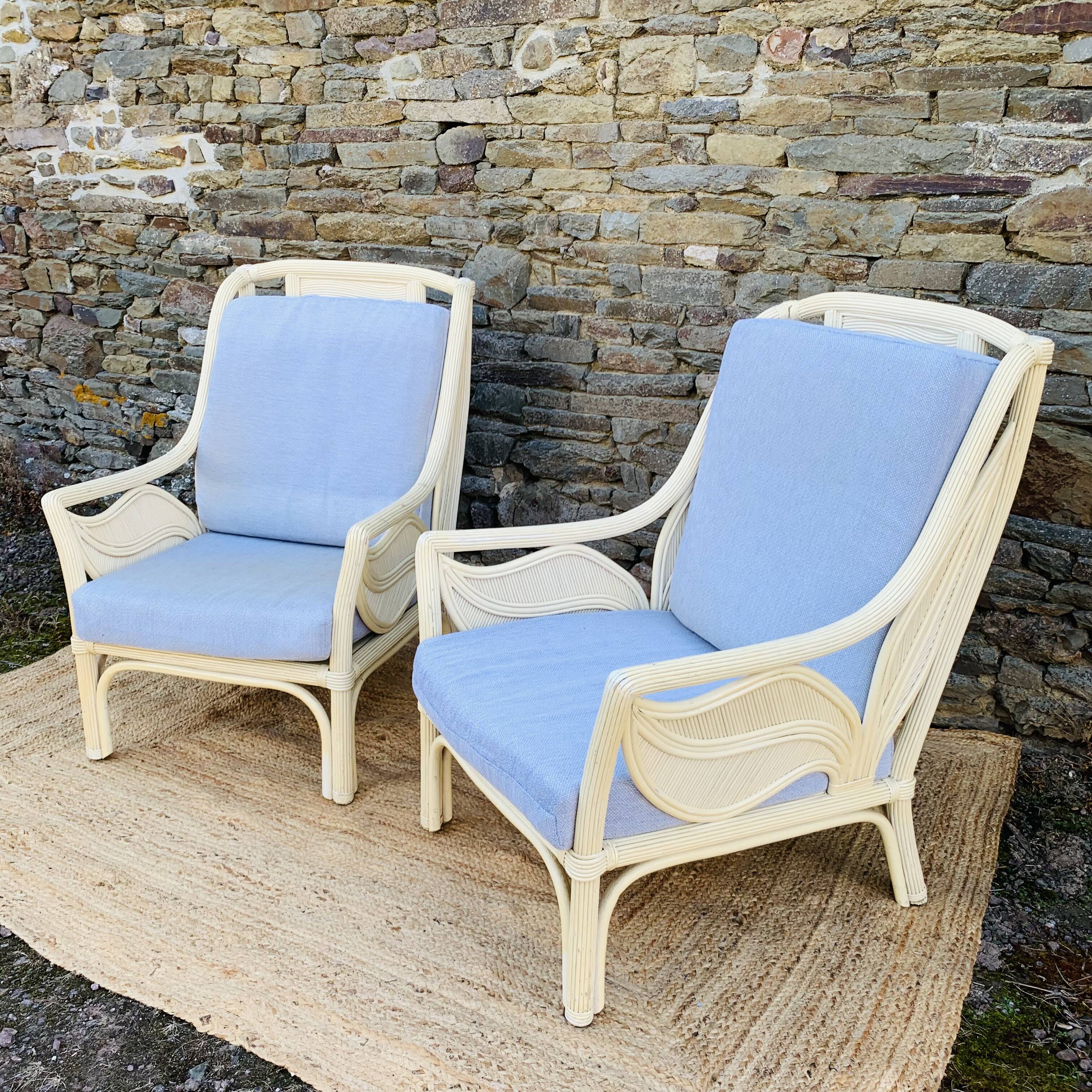 Pair of white rattan armchairs