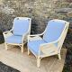 Pair of white rattan armchairs