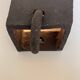 Graphical black stoneware ceramic wall light with handmade ring.