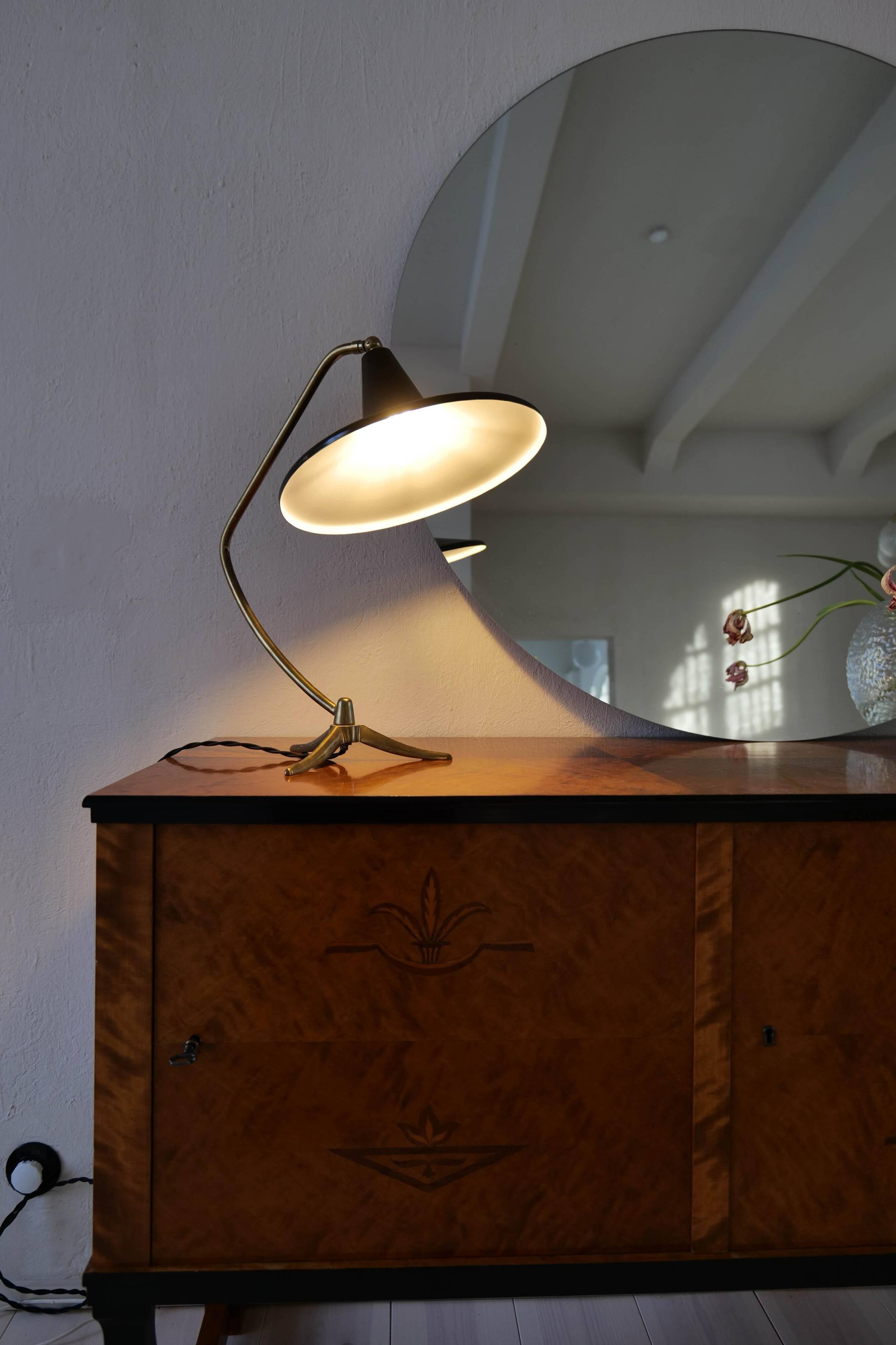 Brass table lamp on a tripod in modern Swedish style, Sweden, 1950.