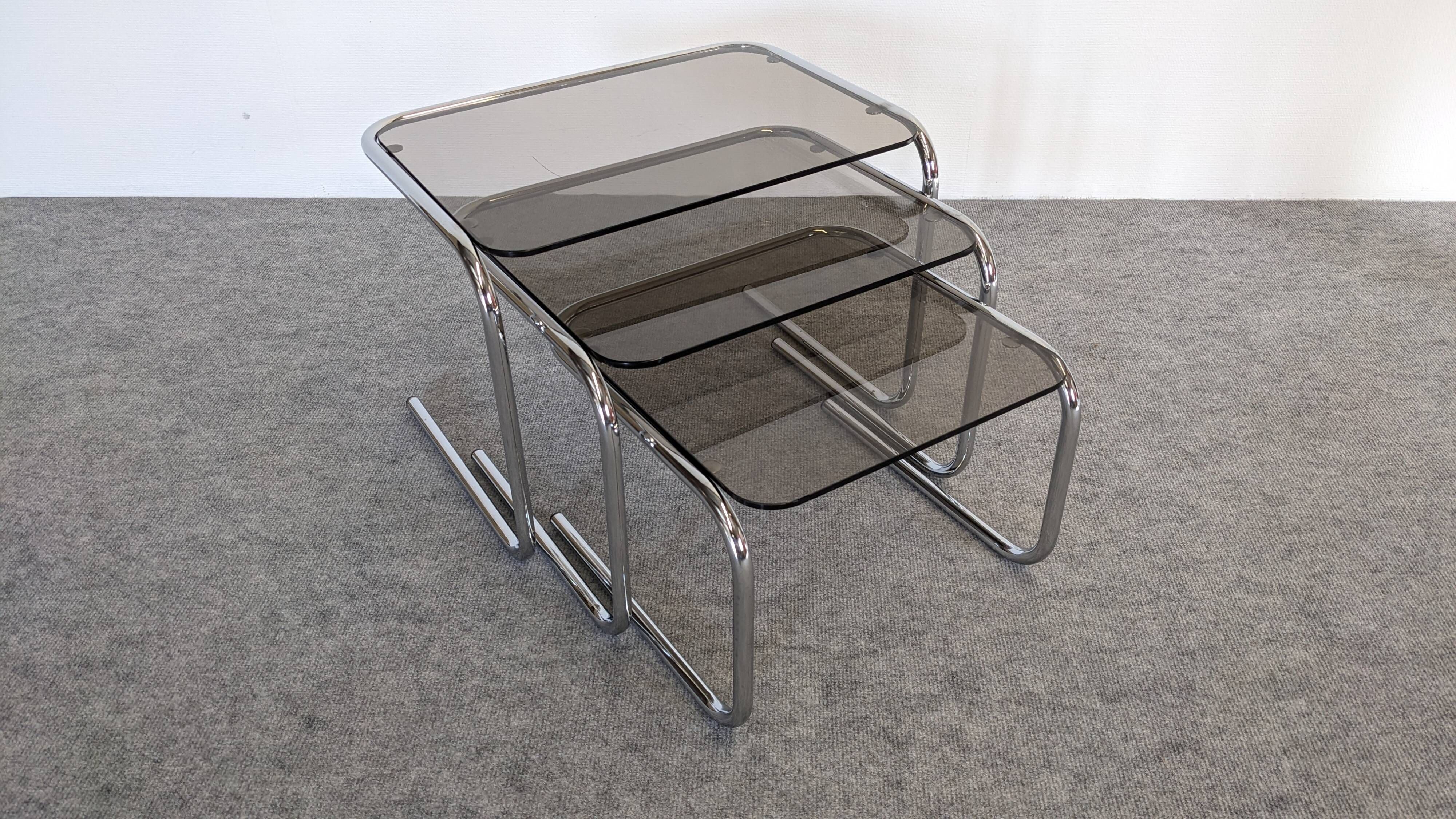 Nested tables with tubular chrome and smoked glass, France 1970.