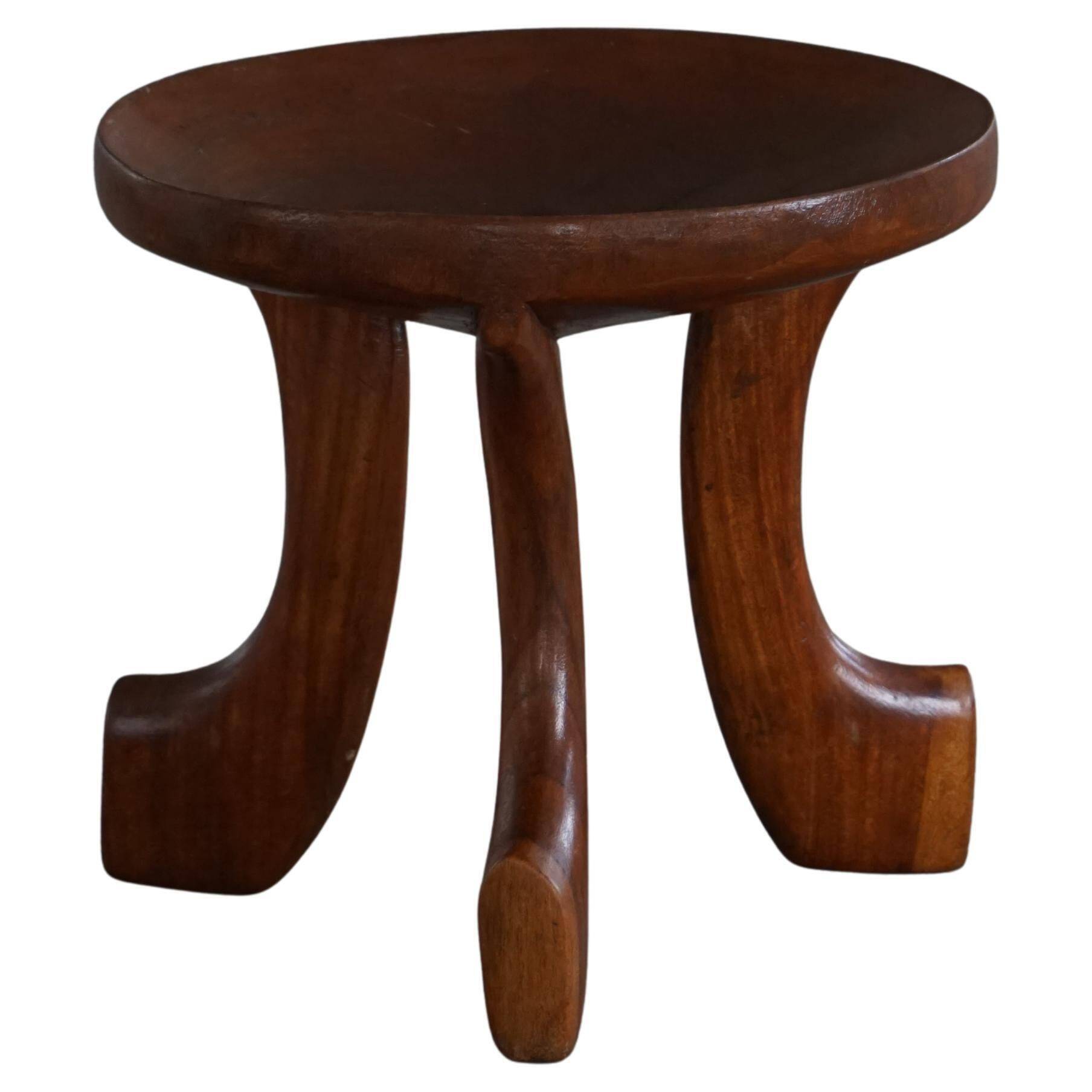 Oromo stool from mid-20th century Africa, hand-carved wood, tribal style.