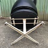 Pair of vintage armchairs in black skai with metal legs.